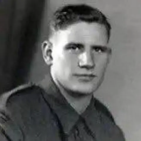 John Swinney Black and white photograph of a man in a wartime military uniform. He is looking at the camera. 