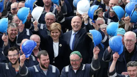 PA Media Jim McColl and Nicola Sturgeon