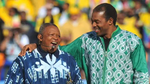 AFP South African trumpeter Hugh Masekela (L) and Nigerian singer Femi Kuti performing during the opening ceremony of the 2010 FIFA World Cup at Soccer City stadium in Soweto, suburban Johannesburg