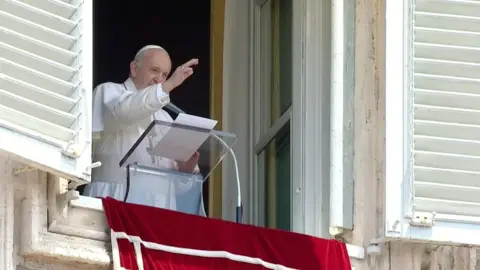 Reuters Pope Francis raises his hand in greeting as he delivers the Angelus hours before being admitted to Gemelli hospital