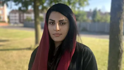 BBC girl wearing scarf in the park