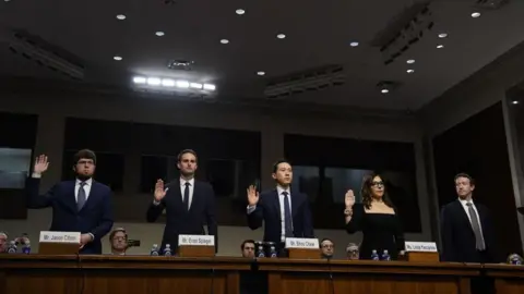 Getty Images A line of 5 tech CEOs are sworn in at a US  Senate Judiciary Committee hearing