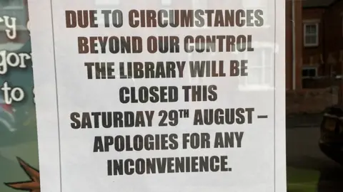 Closed sign at Wollaston Community Library