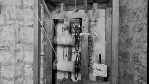 Manx National Heritage An old black-and-white photo of a part of the clock's mechanics 
