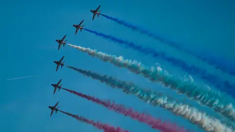 Getty / Hugh R Hastings The RAF's Red Arrows in flight