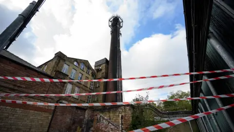 Getty Images Burnt-out telephone mast in Huddersfield UK