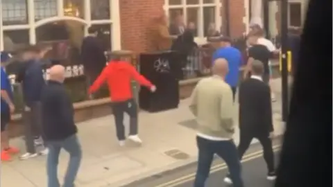 BBC group of men outside a Norwich eaterie