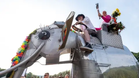 Getty Images Mechanical elephant with baton bearer Mark Jones