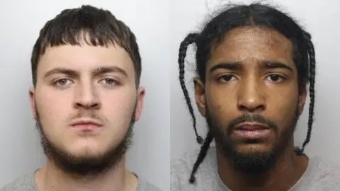 Two mugshots side by side. Left is a man with blue eyes, short brown hair and a fluffy neck beard. He has a thin moustache and a round face. Right is Treasure, whose black hair is in three braids with some hair escaping. He has a beard and moustache.