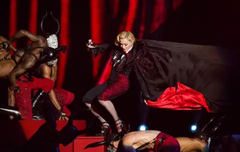 Getty Images Madonna falls as she performs on stage for the BRIT Awards 2015 at The O2 Arena in 2015 in London