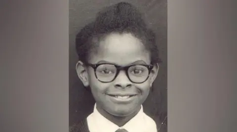 Family handout Saundra Glenn, in glasses, aged seven 