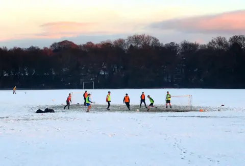 Getty Images A football training session takes place on snow covered pitches on 29 December 2020 in Wilmslow, England