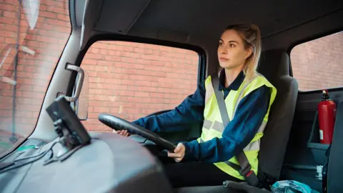 Getty Images Female delivery driver