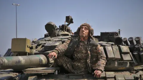 Getty Images A mannequin of an Armenian soldier in a captured tank