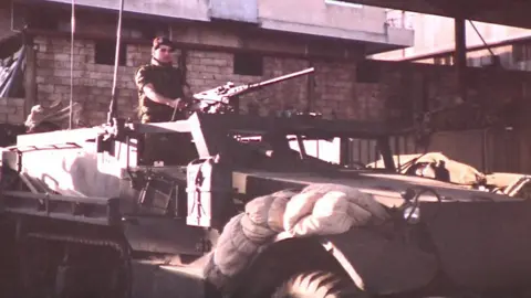 Antoun Moukarzel Antoun in an armoured car during the Lebanese civil war