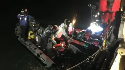 Gendarmerie Maritime Migrants rescued from a small boat off the coast of Calais on Christmas Day