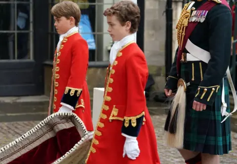 Getty Images Prince George serving as a page of honour at his grandfather's coronation