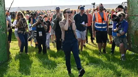 Reuters Emily Eavis, organiser of the annual Glastonbury Festival, officially opens the gates at Worthy Farm for the Glastonbury Festival, in Pilton, Somerset, Britain, June 26, 2024