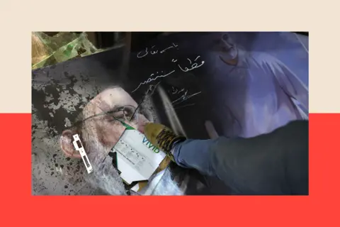 Getty Images A antheral   steps connected  a damaged representation    of slain Hezbollah person  Hassan Nasrallah and Iran's precocious   wide   Qassem Soleimani 