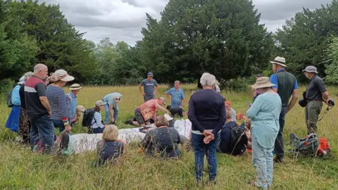 Michael Blencowe Volunteers examining moths caught in a light trap on Graffham Down