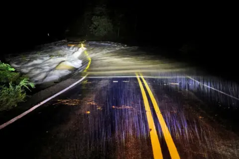 Jonathan Drake/Reuters Floods pour over the Guy Ford Road bridge on the Watauga River as Hurricane Helene approaches the mountains of North Carolina 