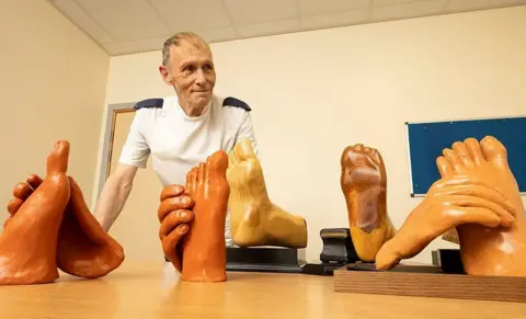 RWT Robert Harness with wooden hands and feet he has made 