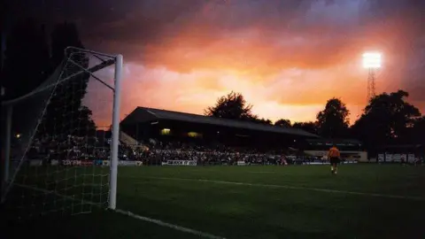 The sun sets over Oxford's Manor Ground.