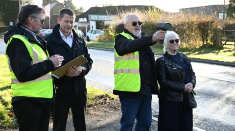 Northamptonshire Police, Fire & Crime Commissioner Members of Staverton Community Speedwatch demonstrating the new equipment.
