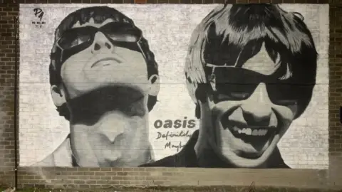 Pic.One.Art Mural of Noel and Liam Gallagher outside Sifters Records in Manchester