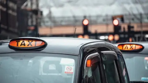 Getty Images Taxis lined up at station