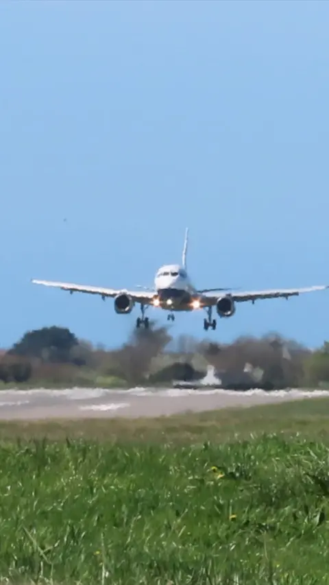 An Airbus A319 landing at Guernsey Airport
