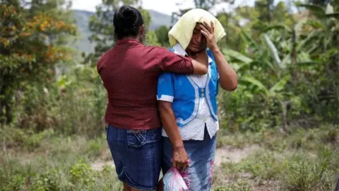 Reuters Relatives and friends lower the coffin with the body of 2-1/2-year-old Guatemalan migrant Wilmer Josue Ramirez, who was detained last month at the U.S.-Mexico border but released from U.S. custody with his mother during treatment for an illness, during his funeral at a cemetery in the village of Olopa, Guatemala May 26, 2019