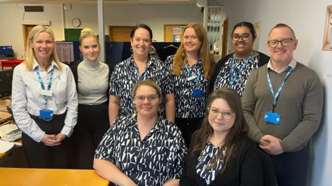 Josh McLaughlin/BBC A group photo of the administrative team at Princes Park Health Centre