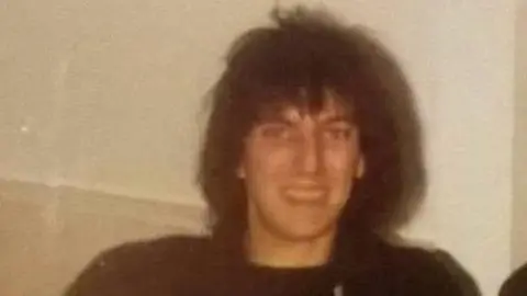 Supplied An old photo of a man with long black hair smiling at the camera