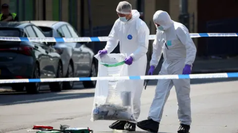  Reuters Forensic officers in Nottingham