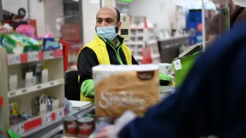 Getty Images A supermarket worker