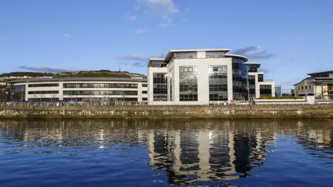 Getty Images Office in the SA1 waterfront area of Swansea, with water in foreground