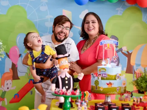 Jessika Ricarte Lucas with his parents on his first birthday