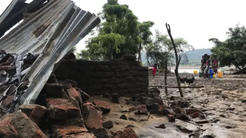 EPA A view on destroyed house after Tropical Storm Ana hit the district of Tete, Mozambique, 27 January 2022