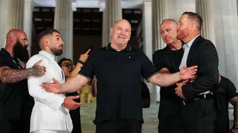 Ilia Topuria and Justin Gaethje in front of the Lincoln Memorial
