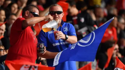 Getty Images A Toulouse supporter and a Leinster supporter share a beer prior to the Heineken Champions Cup Round Pool 1 Round 2 match between Toulouse and Leinster at Stade Ernest Wallon