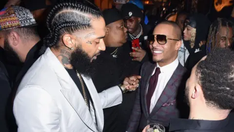 Getty Images Nipsey Hussle with T.I