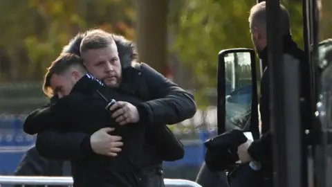 Getty Images James Maddison (left) and a member of Leicester City's security team