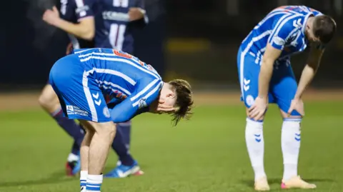 Ben Brannan crouches in disappointment