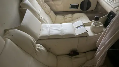 Charterhouse Sporty soft furnishings inside the car with some dirt spots on the seats.