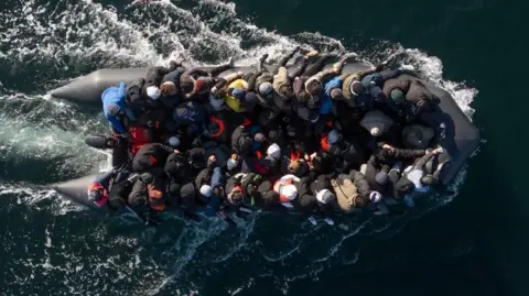 Getty Images An inflatable dinghy carrying around 65 migrants crosses the English Channel on 6 March 2024