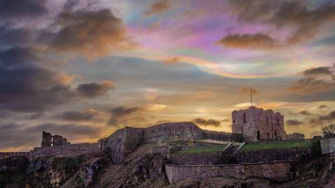 The mother of pearl clouds above The Priory in Tynemouth