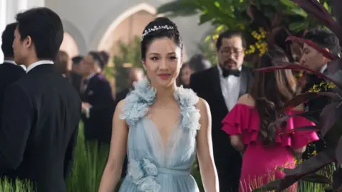 Warner Brothers Movie still from Crazy Rich Asians showing Constance Wu smiling