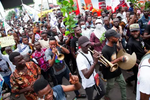 Reuters Musicians play during a demonstration by supporters of opposition leader Martin Fayulu, against changes to the independence of the country's electoral commission, in Kinshasa.