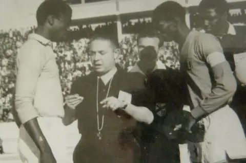 Maher Mezahi Referee talking to two players